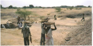 Community construction of an earthern dam for water storage